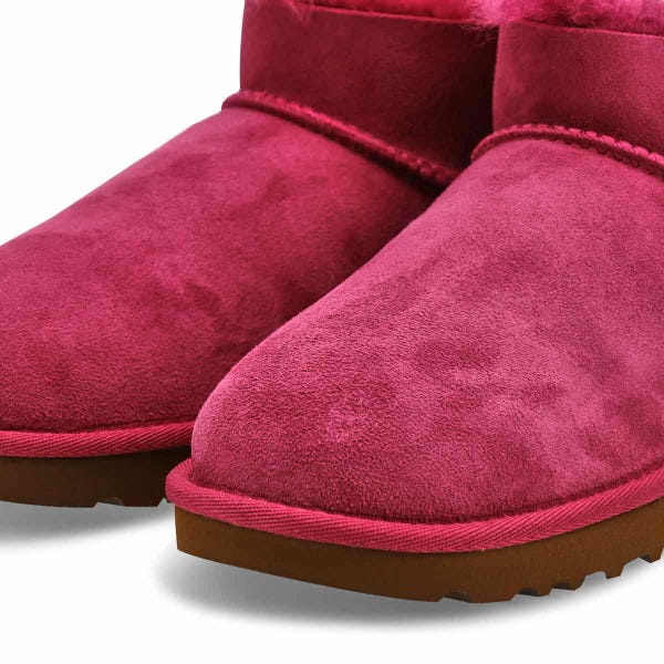 Women's UGG Ultra Mini Bailey Bow sheepskin boot in Dark Winterberry.