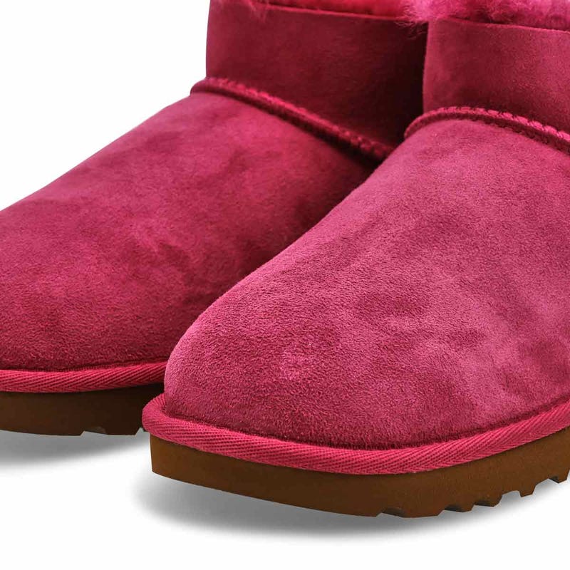 Women's UGG Ultra Mini Bailey Bow sheepskin boot in Dark Winterberry.