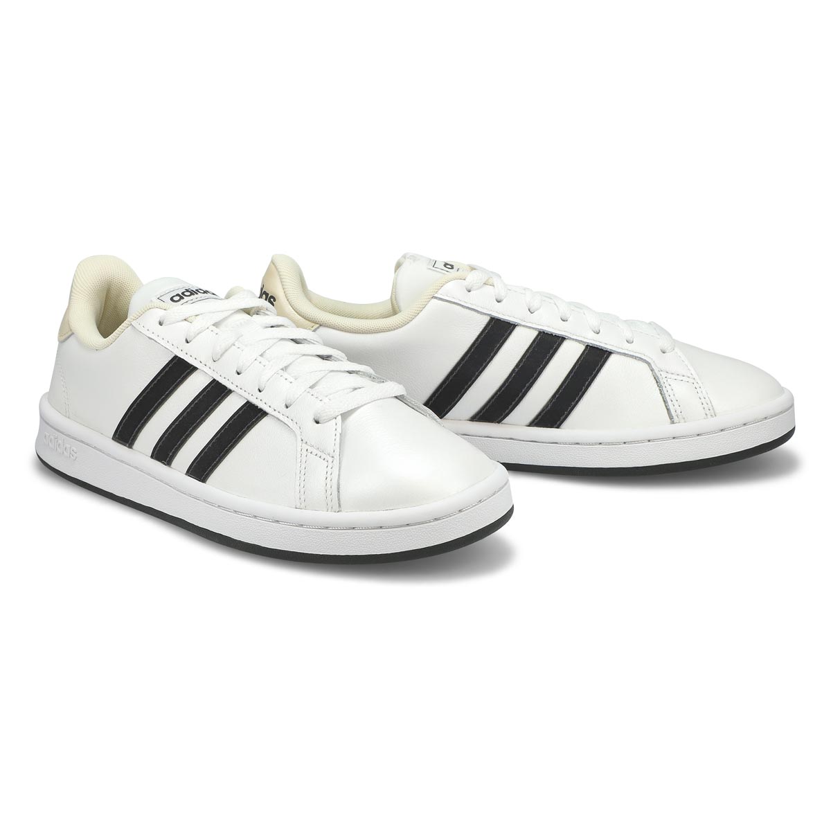 white and black striped adidas shoes